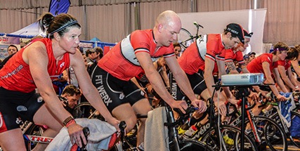 Participants train on stationary bikes