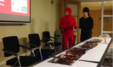 Two costumed club members giving a PowerPoint presentation