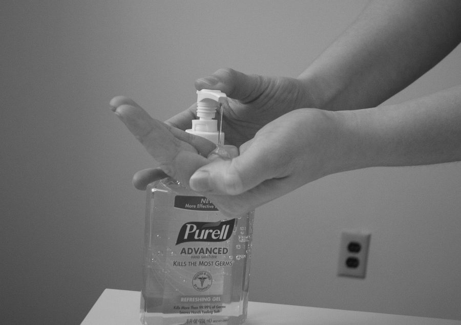 A person putting Purell into their hands