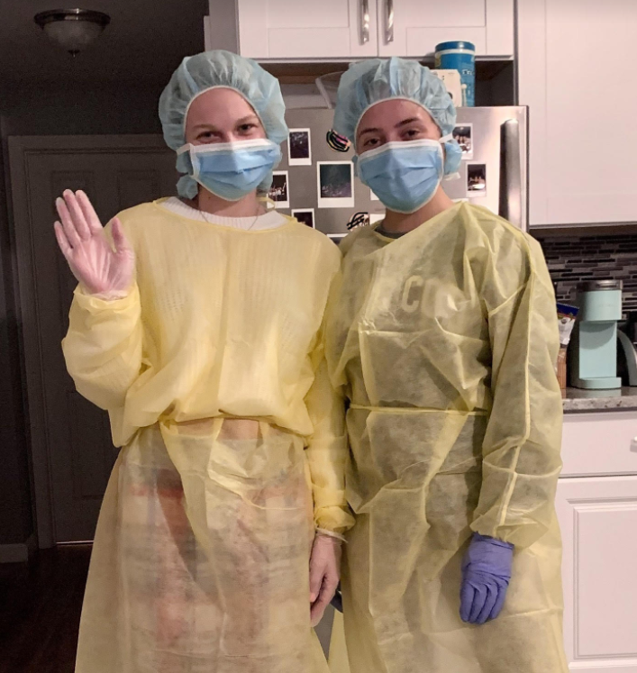 Abigail Dodge, left, and Julia DiGiacomo, right, fully suited up for their clinicals.