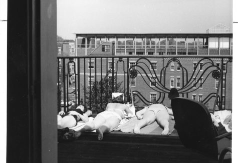 Student sunning themselves on the Evans Hall balcony, 1955. Taken from the Simmons Archive.