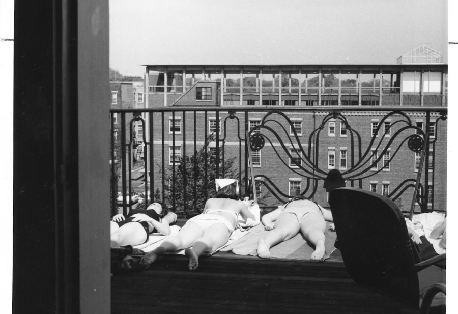 Student sunning themselves on the Evans Hall balcony, 1955. Taken from the Simmons Archive.